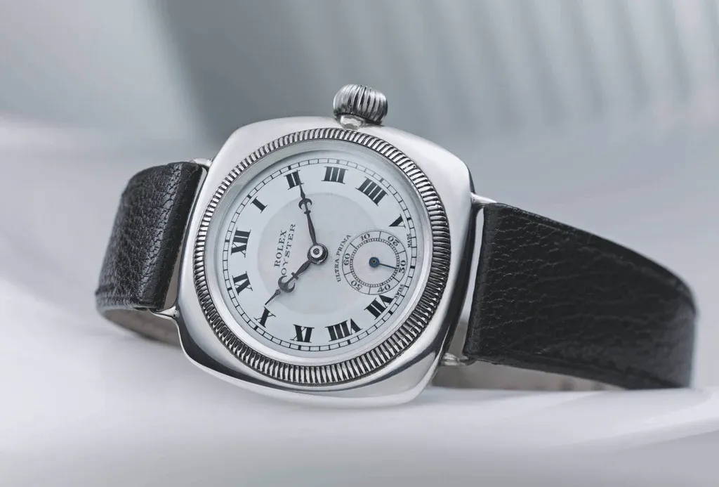 Vintage replica Rolex Oyster Perpetual with white dial and black leather strap