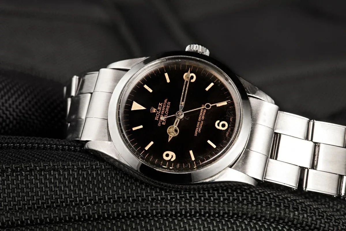 Vintage Rolex Explorer black dial showing patina character on Oyster bracelet