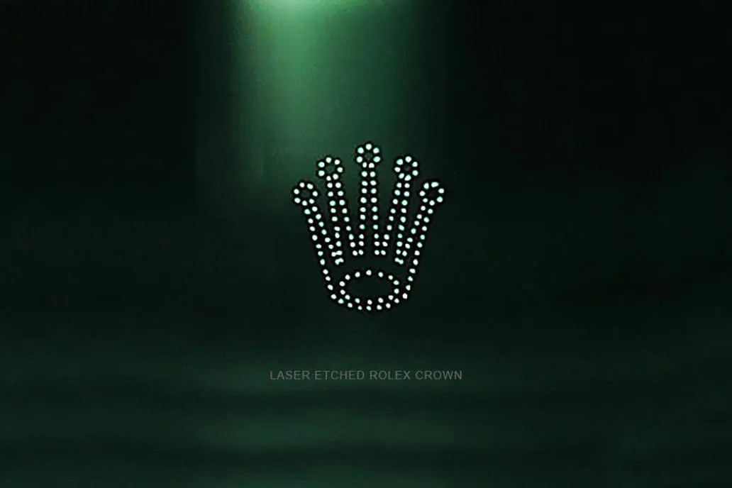 Laser-etched crown at 6 o’clock on sapphire crystal 2025