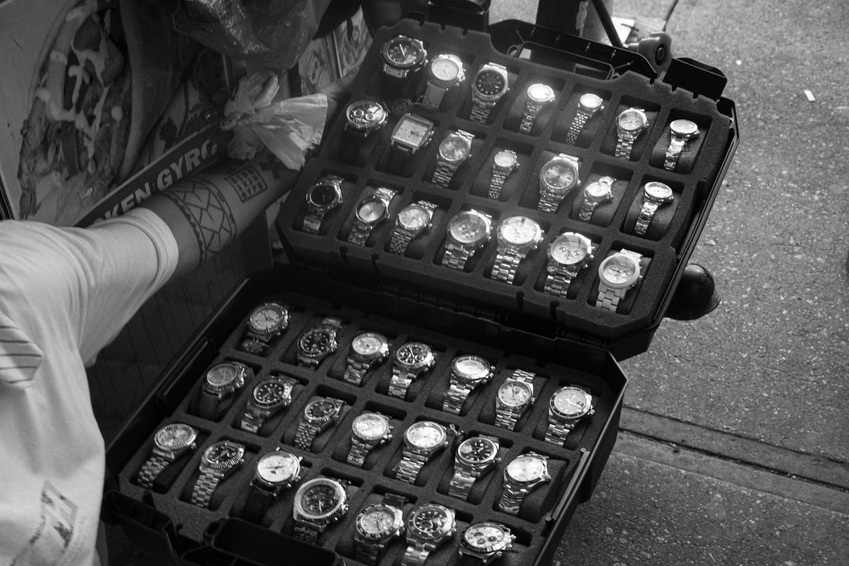Canal Street NYC fake watches market with counterfeit Rolex watches displayed for sale