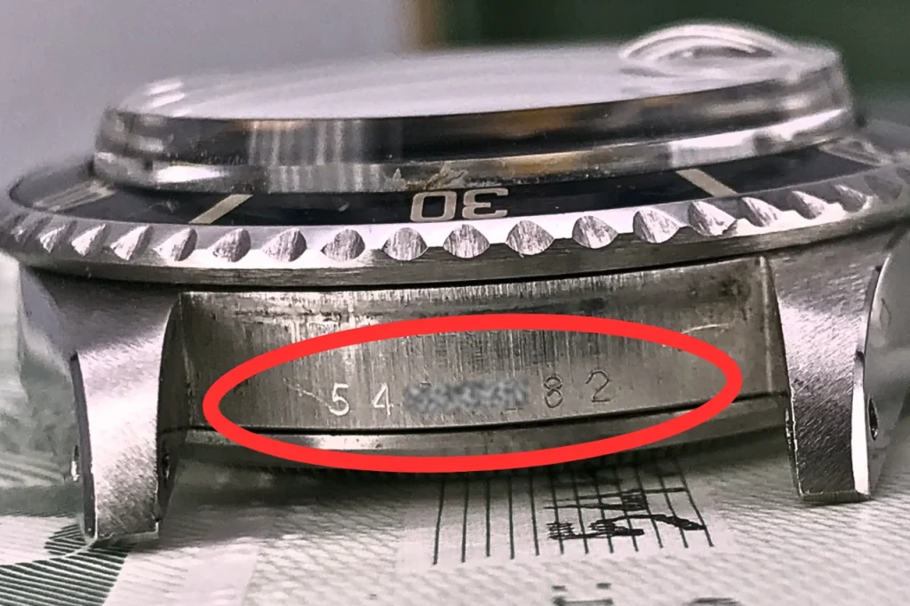Rolex serial number engraved between the lugs at 6 oclock position